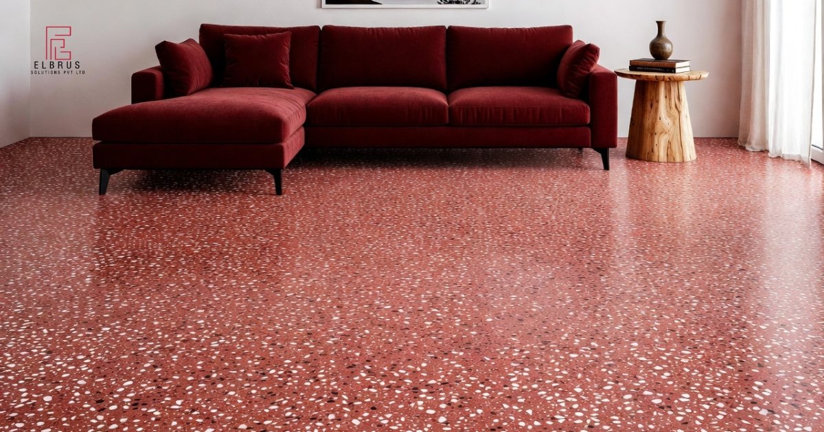 Modern kitchen interior featuring seamless terrazzo flooring with natural daylight and minimal decor.