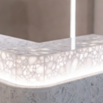 Modern terrazzo reception desk with LED edge lighting showcasing innovative interior design concept