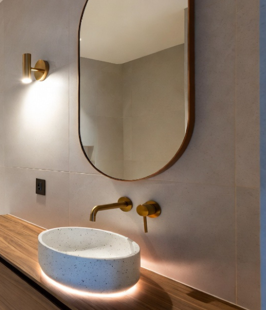“Close-up shot of a terrazzo washbasin showing colorful marble chips, polished surface, high detail texture, natural lighting, premium finish, architectural photography”