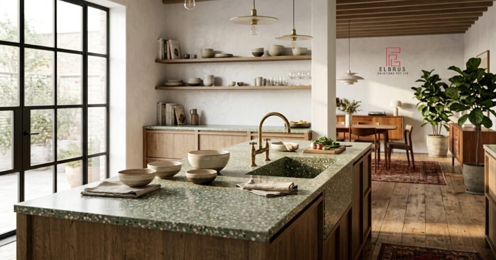 Close-up of polished oversized chip terrazzo floor with blush, green, and burgundy marble fragments in ivory binder — terrazzo pattern trend 2026