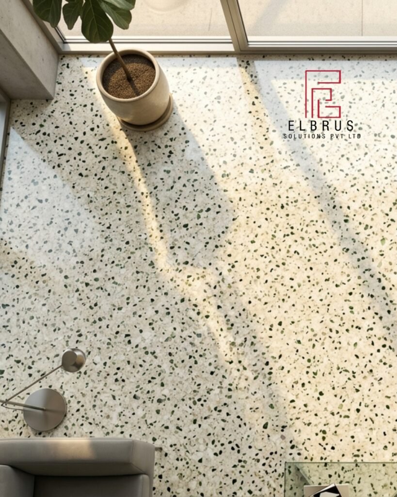 Polished terrazzo floor with marble chips and recycled glass aggregates reflecting natural sunlight in a modern interior space