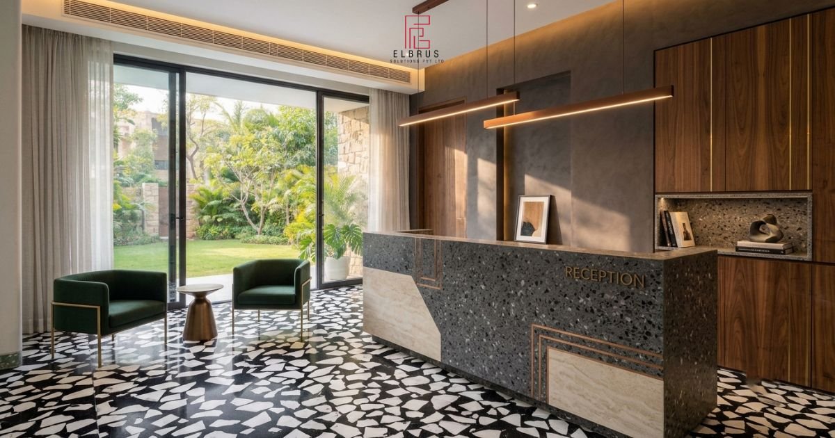 Charcoal terrazzo reception counter with copper-toned details.